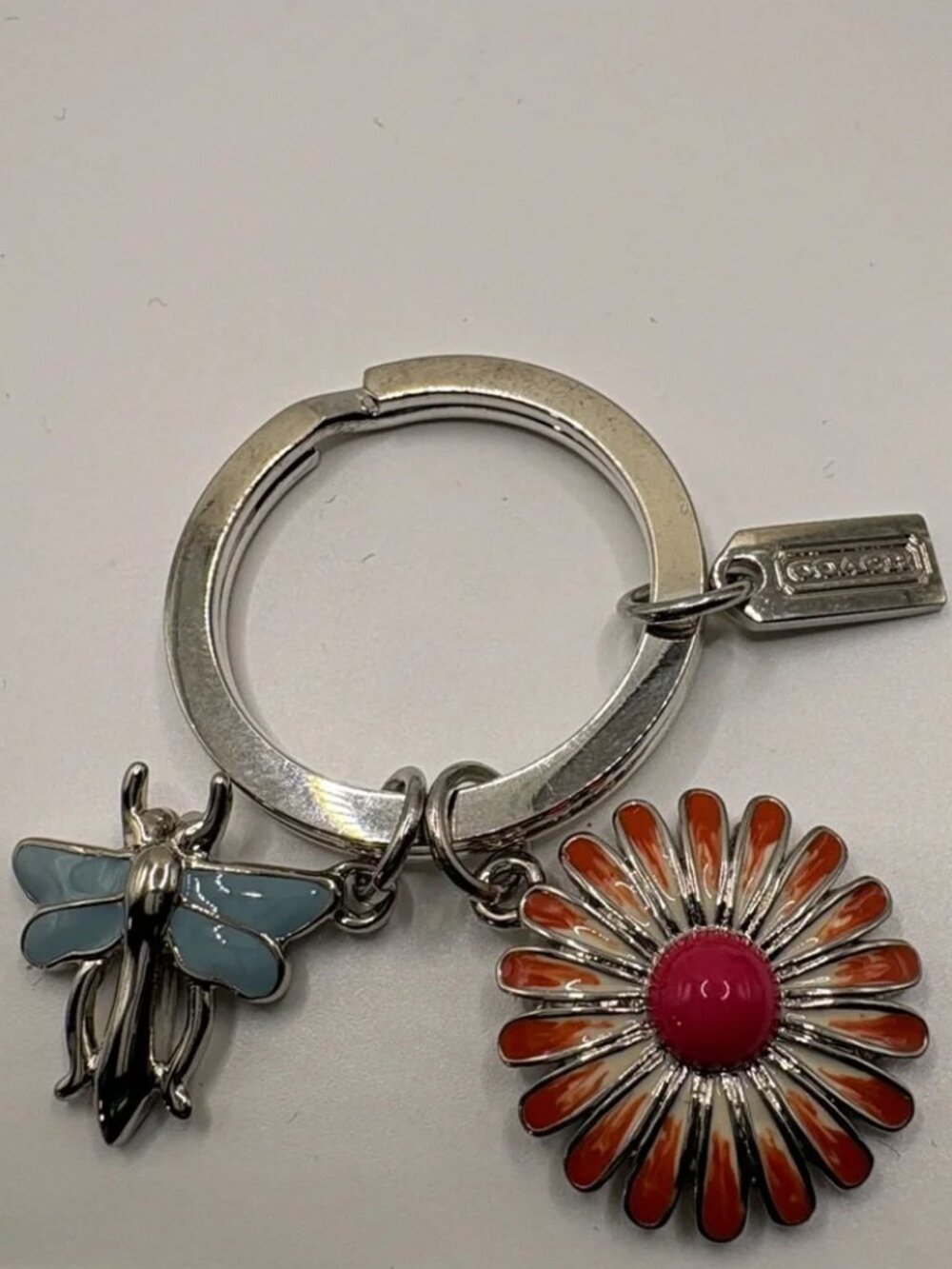 Coach Silver Key Ring with Orange Daisy and Light Blue Dragonfly Charms NWOT